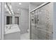 Modern bathroom showcasing a glass door shower, granite countertop, and modern fixtures at 1101 Bay Pine Blvd, Indian Rocks Beach, FL 33785