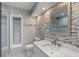 Bright bathroom with white marble walls, granite countertops, modern fixtures, and glass shower at 1101 Bay Pine Blvd, Indian Rocks Beach, FL 33785