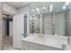 Contemporary bathroom with marble countertop vanity, modern light fixtures and glass-enclosed shower at 1101 Bay Pine Blvd, Indian Rocks Beach, FL 33785
