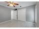 Bright, spacious bedroom features neutral walls, ceiling fan, and a large closet at 1101 Bay Pine Blvd, Indian Rocks Beach, FL 33785