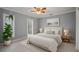 Stylishly decorated bedroom features a comfortable bed, two nightstands, and an ensuite bathroom at 1101 Bay Pine Blvd, Indian Rocks Beach, FL 33785