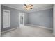Minimalist bedroom with tile floors, ensuite bathroom, and window with blinds at 1101 Bay Pine Blvd, Indian Rocks Beach, FL 33785