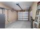Clean two-car garage with automatic door opener and storage racks at 1101 Bay Pine Blvd, Indian Rocks Beach, FL 33785