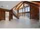 Open living room boasting high wood ceilings, oversized windows, and pool views at 1101 Bay Pine Blvd, Indian Rocks Beach, FL 33785