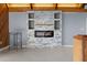 Living room showcasing a stone fireplace, modern design, and sleek flooring at 1101 Bay Pine Blvd, Indian Rocks Beach, FL 33785