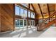 Bright living room with vaulted wood ceilings, a chandelier, and sliding glass doors to the pool area at 1101 Bay Pine Blvd, Indian Rocks Beach, FL 33785
