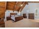 Spacious main bedroom with vaulted ceiling, modern wood furniture, and ample natural light at 1101 Bay Pine Blvd, Indian Rocks Beach, FL 33785