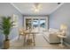 Comfortable home office includes a modern desk and chair, natural light, and serene views at 1101 Bay Pine Blvd, Indian Rocks Beach, FL 33785