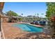 Refreshing pool surrounded by a brick patio, with a barbecue grill and waterfront views, perfect for relaxation at 1101 Bay Pine Blvd, Indian Rocks Beach, FL 33785