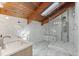 Beautiful bathroom showcasing an oversized walk-in shower with rainfall showerhead and bench seating at 1101 Bay Pine Blvd, Indian Rocks Beach, FL 33785