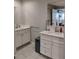 Bright bathroom with dual vanities, tile floors, and modern fixtures at 11233 51St N Ave, St Petersburg, FL 33708