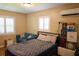Bedroom features bright windows, comfortable bedding, and efficient mini-split air conditioning at 11233 51St N Ave, St Petersburg, FL 33708