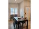 Inviting dining room area featuring a modern table set, seating, and natural light from a window with shutters at 11233 51St N Ave, St Petersburg, FL 33708