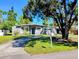 Charming single-story home with a well-manicured lawn and a concrete driveway leading to the house at 11233 51St N Ave, St Petersburg, FL 33708