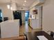 Bright, updated kitchen features white cabinetry, quartz countertops, black appliances, and an island at 11233 51St N Ave, St Petersburg, FL 33708