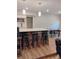 Contemporary kitchen boasts an island with bar seating, modern pendant lighting, and an adjacent dining area at 11233 51St N Ave, St Petersburg, FL 33708