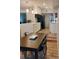 Well-lit kitchen with a spacious quartz island, black appliances, and a dining area at 11233 51St N Ave, St Petersburg, FL 33708