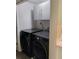 Modern laundry room with sleek washer and dryer units and ample storage space at 11233 51St N Ave, St Petersburg, FL 33708