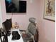 A home office featuring a modern ergonomic chair, monitors and a minimalist decor at 11233 51St N Ave, St Petersburg, FL 33708