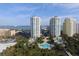 Stunning aerial view of Grande condominiums, beaches, pools, palm trees, and ocean views at 1180 Gulf Blvd # 1201, Clearwater, FL 33767