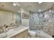 Bathroom with marble countertops, glass shower and recessed lighting at 1180 Gulf Blvd # 1201, Clearwater, FL 33767