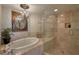 Relax in this bathroom's standalone soaking tub or walk-in shower with decorative accents at 1180 Gulf Blvd # 1201, Clearwater, FL 33767
