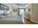 Bright bedroom with ocean view, hardwood floors, neutral colors and stylish decor at 1180 Gulf Blvd # 1201, Clearwater, FL 33767