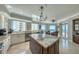 Gourmet kitchen with island, stone countertops, and ocean views at 1180 Gulf Blvd # 1201, Clearwater, FL 33767