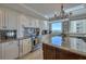 Modern kitchen with stainless steel appliances, an island and a gorgeous backsplash at 1180 Gulf Blvd # 1201, Clearwater, FL 33767