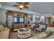 Spacious living room with comfortable seating and refined décor features entertainment center at 1180 Gulf Blvd # 1201, Clearwater, FL 33767