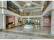 Grand lobby with a water feature, marble floors, and soaring ceilings at 1180 Gulf Blvd # 1201, Clearwater, FL 33767