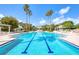 Stunning community pool and sun deck with lush landscaping and shaded cabanas at 1180 Gulf Blvd # 1201, Clearwater, FL 33767
