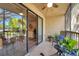 This relaxing screened balcony leads to the living room through sliding glass doors at 1398 Shady Pine Way # H2, Tarpon Springs, FL 34688