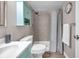 Updated bathroom with a walk-in shower, modern vanity, and stylish fixtures at 1398 Shady Pine Way # H2, Tarpon Springs, FL 34688