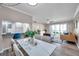 Open floor plan featuring dining area, living room, and kitchen with bar seating in a well-lit space at 1398 Shady Pine Way # H2, Tarpon Springs, FL 34688