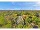 Beautiful view of an apartment complex with mature green trees at 1398 Shady Pine Way # H2, Tarpon Springs, FL 34688