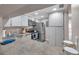 Bright kitchen features stainless steel appliances, ample storage, and a convenient eat-in bar countertop at 1398 Shady Pine Way # H2, Tarpon Springs, FL 34688