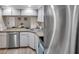 Bright kitchen view to dining area, featuring stainless appliances and great light at 1398 Shady Pine Way # H2, Tarpon Springs, FL 34688