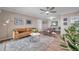 Comfortable living room offering a seamless transition to the dining area and kitchen at 1398 Shady Pine Way # H2, Tarpon Springs, FL 34688
