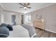 Charming main bedroom with hardwood floors and a bathroom doorway providing easy access at 1398 Shady Pine Way # H2, Tarpon Springs, FL 34688
