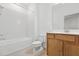 Bathroom featuring tile flooring, a shower and tub combo, toilet, and vanity at 14180 Samoa Hill Ct, Riverview, FL 33569