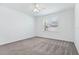A bright and airy bedroom with a ceiling fan at 14180 Samoa Hill Ct, Riverview, FL 33569
