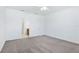 Spacious bedroom with carpet, ceiling fan, and door to bathroom at 14180 Samoa Hill Ct, Riverview, FL 33569
