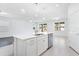 Open floor plan with center kitchen island and stainless steel appliances at 14180 Samoa Hill Ct, Riverview, FL 33569