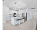 Modern kitchen featuring stainless steel appliances, a center island with seating, and white cabinetry at 14180 Samoa Hill Ct, Riverview, FL 33569
