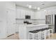 Bright kitchen featuring island with seating, stainless appliances, and pendant lighting at 14180 Samoa Hill Ct, Riverview, FL 33569