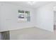 Light-filled room with neutral walls, window, and tile flooring at 14180 Samoa Hill Ct, Riverview, FL 33569