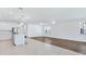 Bright open-concept home with wood and tile flooring connecting living and kitchen areas at 14180 Samoa Hill Ct, Riverview, FL 33569