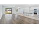 Open-concept living space includes hardwood floors, lots of natural light, and an eat-in kitchen area at 14180 Samoa Hill Ct, Riverview, FL 33569