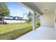 Covered patio offers a view of the spacious fenced backyard and landscaping at 14180 Samoa Hill Ct, Riverview, FL 33569